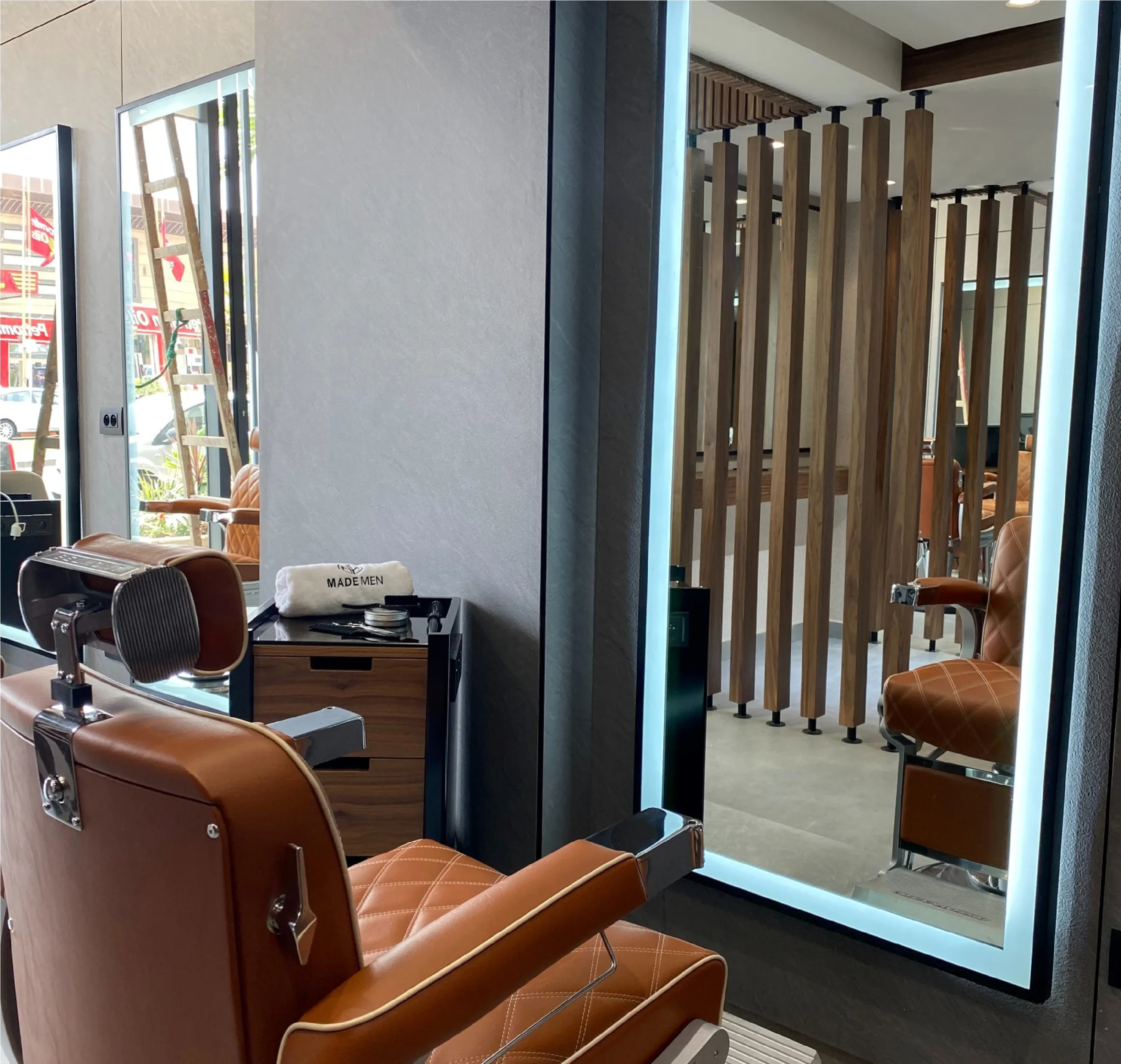 Barber stations with cognac leather chairs