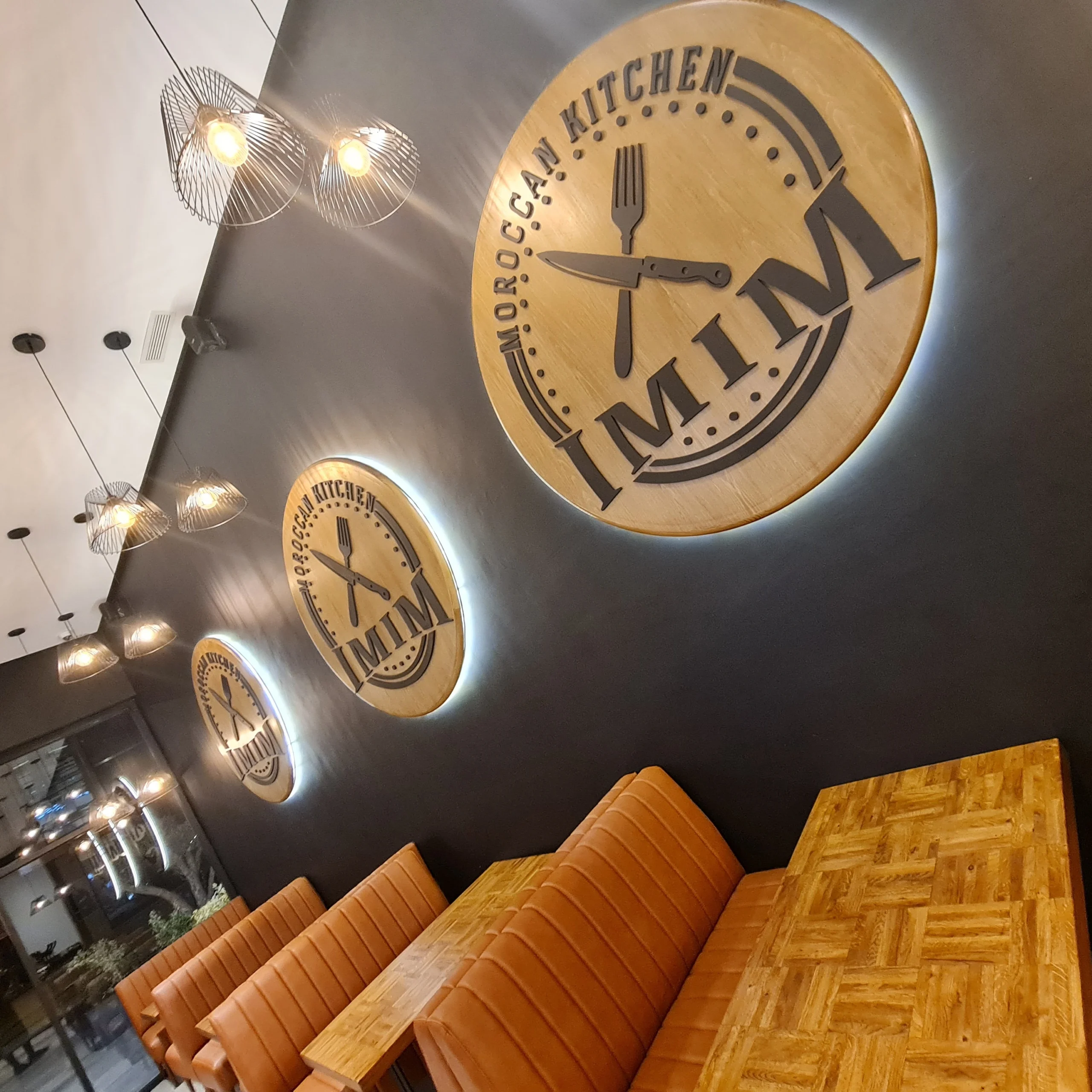 Leather banquette seating with wood dining chairs