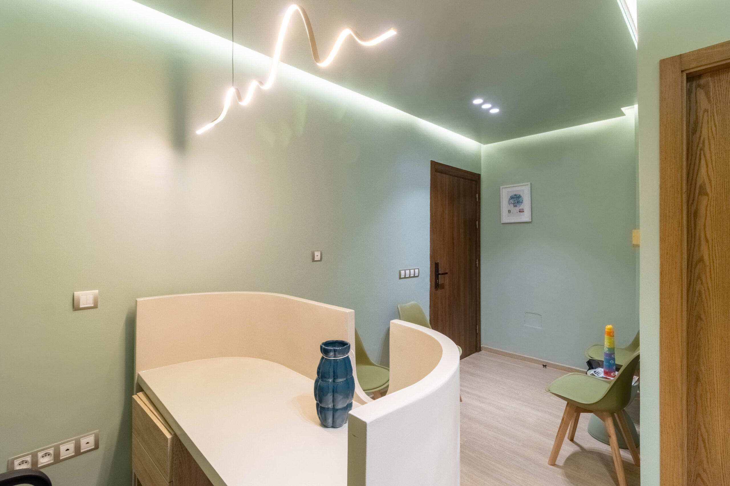 Waiting area with parent seating and natural materials